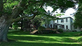 View of House from Pond - Country homes for sale and luxury real estate including horse farms and property in the Caledon and King City areas near Toronto